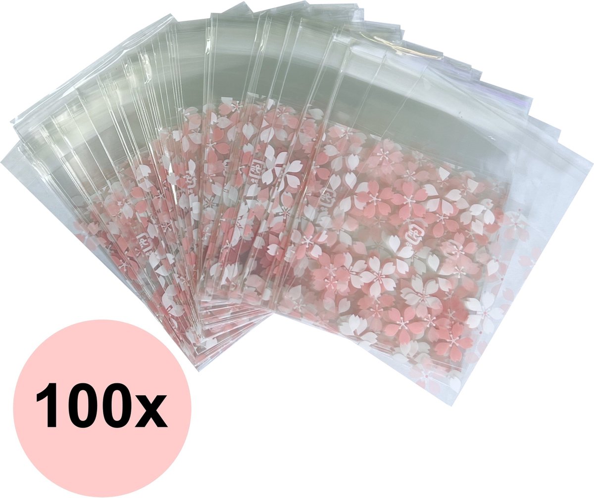 Fako Bijoux® - 100x Uitdeelzakjes - Cellofaan Plastic Traktatie Kado Zakjes - Snoepzakjes - Bloemetjes Roze/Wit - 7x7cm